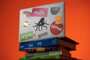 Laptop with stickers all-over and The Starr Conspiracy logo