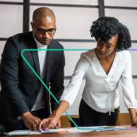 Photo of two businesspeople with Viewpointe parallelogram with gradient stroke