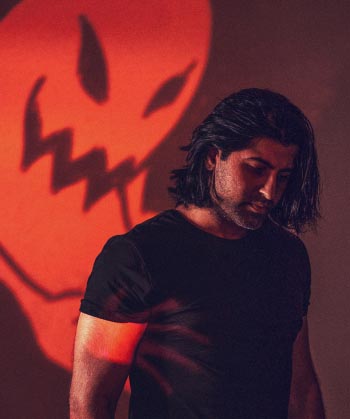 Portrait of Zohaib with red ghost projected behind